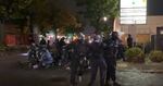 Portland police moved swiftly Saturday night, Oct. 10, 2020, making blanket arrests at a protest outside the police bureau's North Precinct.