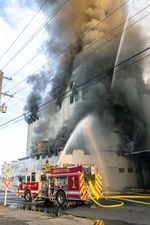 Smoke pours from the Pendleton Flour Mills on the morning of Wednesday, August 10, 2022 as firefighters work to control the blaze.