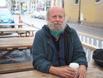 Douglas Marcks, who also goes by "Wookiee" enjoys a cup of coffee near the Street Roots office in downtown Portland on March 23, 2022.