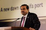 Gautham Adani, billionaire and chairman of the Adani Group, speaks at an event held at the port of Haifa, Israel on Tuesday. An Indian billionaire whose business empire has been shaken by fraud allegations by short-selling Hindenburg Research said his company will increase its investment in Israel.