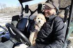 Rancher Ian Wilson and his dog Buddy regularly walk the newly restored floodplain looking for wildlife, 