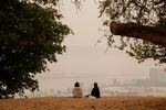 A lone couple takes in a smokey view at the Skidmore Bluffs, a usually packed overlook popular with picnickers taking in the sunset. Due to smoke blowing in from several surrounding wildfires, the air quality in Portland, OR been ranked the worst of all major cities in the world. Sept. 10, 2020.