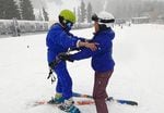 Ski instructor Destinie Davis helps a participant of Open Slopes PDX keep their balance at Mt. Hood Meadows Ski Resort.