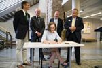 Gov. Kate Brown signs Senate Bill 81 at Columbia Gorge Community College on July 17.
