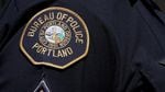 A photo of a Portland police patch on an officer's uniform.