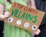 One of thousands of young people who marched through downtown Portland, May 20, 2022, holds a sign, as part of a youth-led climate mobilization.