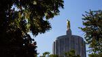 Sun glints off the pioneer atop the Oregon Capitol building in Salem, Ore., Saturday, June 29, 2019. Republican senators returned to the Capitol after a nine-day walkout in order to finish Senate business before the June 30 deadline.