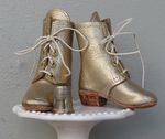 Allison Wonder creates handmade shoes and boots, with real stacked leather heels and lots of tiny grommets.