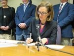 Oregon Governor Kate Brown signs a drought emergency declaration in Klamath Falls on Tuesday, March 13, 2018.