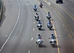 Motorcylces leading the procession of Sergeant Jeremy Brown drive up I-5 North in Clark Country, Washington, Tuesday, August 3.