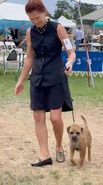 Valerie Christensen declined to compete in one dog show this summer because it was 114 degrees outside. Here she is with Henry the Border Terrier at the cooler Hurricane Ridge dog show in Sequim, Wash., on July 31.