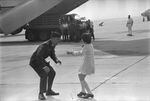 Released POW, Air Force Maj. Jay C. Hess reunites with his daughter. March AFB, California. Feb. 18, 1973.