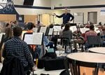 Newport Symphony music director and conductor Adam Flatt directs the orchestra in a rehearsal of the new musical piece "Yakona."