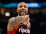 Damian Lillard of the Portland Trail Blazers reacts against the Phoenix Suns during the first quarter on Dec. 14, 2021, in Portland, Ore.