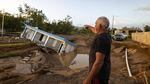 A man points to a home that was collapsed by Hurricane Fiona at Villa Esperanza in Salinas, Puerto Rico, Wednesday, September 21, 2022.