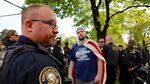 Jeremy Joseph Christian (center wearing American flag), the man accused of a fatal stabbing on the MAX train, attended the April 29 "March for Free Speech" on 82nd Avenue.
