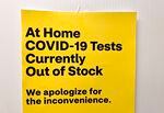 A sign outside a downtown CVS pharmacy alerts customers that home COVID-19 tests are out of stock at the location, Jan. 7, 2022. 