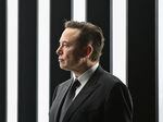 Elon Musk seen in profile.
