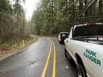 Crews at Oregon's Silver Falls State Park work to cleared downed trees on Tuesday.
