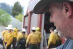 Dillon Sanders looks on as a collection of wildland firefighters train for an upcoming season. Sanders is the owner of Inbound LLC in Oakridge, Oregon, which runs 20-person hand crews and 13 engines for fire suppression. 