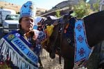 Miss Warm Springs Thyreicia Simtustus prepares her horse Sting for the horse parade to mark Kah-Nee-Ta's last weekend. 
