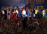 Da Silva (center) sings the national anthem during a rally in the final week of campaigning at Portela Samba School in Rio de Janeiro on Sunday.