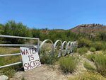 A sign near the border of the Cholla Canyon Ranch, the site of the Ha' Kamwe' hot springs. "There's not enough water in the area," says Philip Wisely, director of the Hualapai Tribe's Public Service Department. "So this is the wrong place to put a mine for lithium."