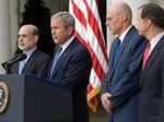 Then-President George W. Bush stands with Federal Reserve Chairman Ben Bernanke (L), Treasury Secretary Henry Paulson and Securities and Exchange Commission Chair Christopher Cox to discuss the economy at the White House in Washington, D.C., on Sept. 19, 2008.