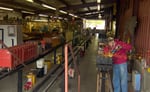 Inside the shop of Train Mountain, members work on their trains.