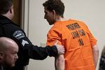 Bryan Kohberger, right, who is accused of killing four University of Idaho students in November 2022, is led away following a hearing in Latah County District Court, Thursday, Jan. 5, 2023, in Moscow, Idaho.