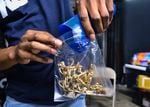 In this May 24, 2019, file photo a vendor bags psilocybin mushrooms at a pop-up cannabis market in Los Angeles. Voters in Oregon voted in November to legalize therapeutic, regulated use of psilocybin. 