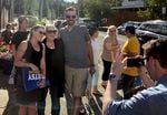 Betsy Johnson poses with supporters during a July 7, 2022, event in downtown Milwaukie, Ore. Johnson is running for governor as an unaffiliated candidate.