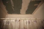 The ceiling in Crispin's bathroom leaks and has required frequent patching.