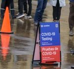 Over 50 people were waiting in line for a COVID-19 test at the Oregon Convention Center testing site operated by Curative, Jan. 6, 2022. A staff member told people in line that the wait was 45-60 minutes. Getting access to tests has become increasingly challenging.