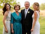 President George W. Bush and first lady Laura Bush pose with their daughters Jenna Bush, 26, right, and Barbara Bush, left, prior to Jenna's marriage to Henry Hager at the family's ranch in Crawford, Texas.