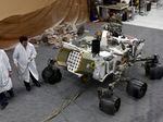 Engineers work on a model of the Mars rover Curiosity at the Spacecraft Assembly Facility at NASA's Jet Propulsion Laboratory in 2012.