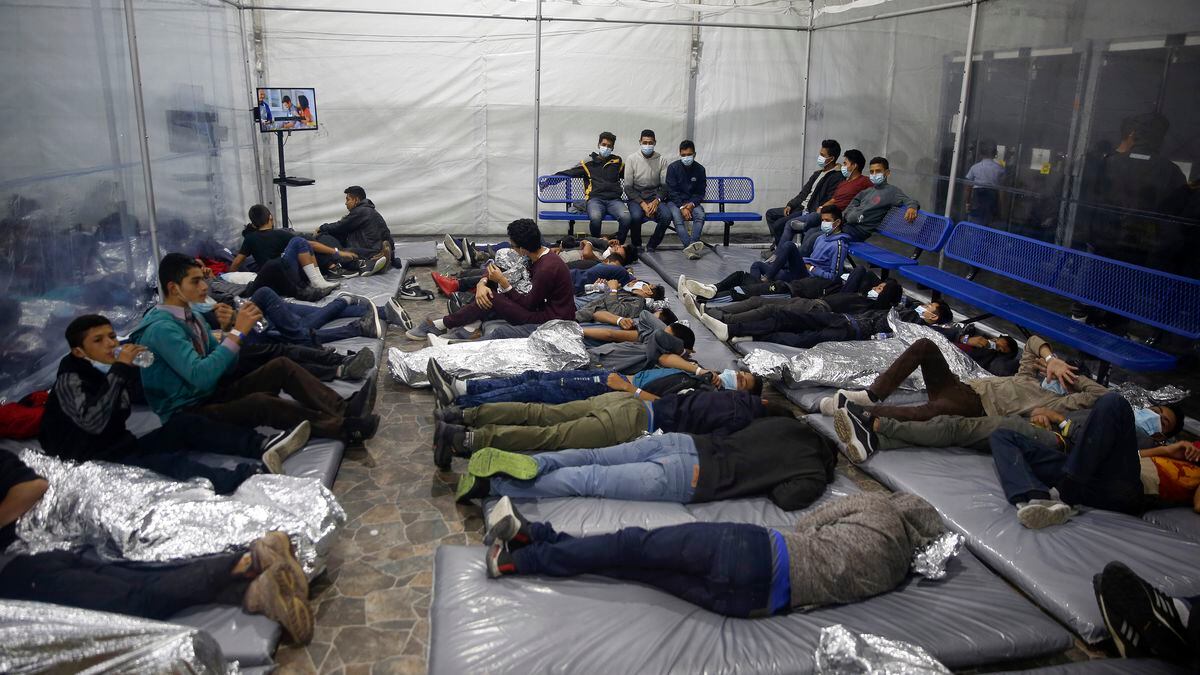 immigration sleeping on a mattress on the floor