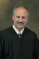 Clark County District Court Judge Darvin Zimmerman posted alongside his official biography on the county website.