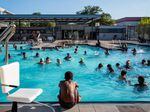 Houstonians cool off at the Emancipation Swimming Pool on July 19. Texas is one of many places in the U.S. under excessive heat warnings.