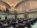 The Washington Senate chamber sits empty before the start of the legislative session on Jan. 11, 2021. Senate Democrats are taking the lead this year on a decade-long effort to pass a capital gains tax in Washington.