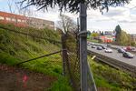 The I-5 freeway is seen through the fencing at the back of Harriet Tubman Middle School (left) in North Portland, April 9, 2021. ODOT's proposed Rose Quarter expansion would bring the freeway even closer to the school grounds.