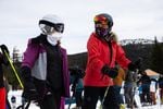 Skiers wear face coverings at Mt. Bachelor ski resort outside Bend, Ore., Monday, Dec. 7, 2020. Mt. Bachelor opened its winter ski season with new restrictions to limit the spread of coronavirus.