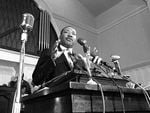 In this 1960 file photo, Rev. Martin Luther King Jr. speaks at a podium in Atlanta.