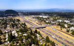 The first toll could go into effect as early as next year on Interstate 205, shown here in this July 2022 file photo, near Oregon City, and city officials there fear already congested streets will get worse as drivers leave the freeway for other routes.