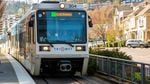 A TriMet Green Line MAX train approaches a station in southwest Portland, Ore., on Friday, March 20, 2020. The public transportation agency reported widespread dips in ridership due to the ongoing coronavirus pandemic.