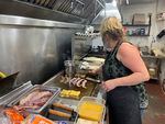 Gramma's Corner Kitchen co-owner Tracy Roundy tending the griddle on May 9, 2021. She's been trying to hire a cook for months.