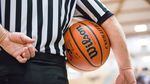 A referee holds the ball in the quarterfinals of the OSAA 6A Boys Basketball Championships between Grant High School and West Salem High School at the Chiles Center in Portland, Oregon, Thursday, March 8, 2018.