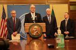 Washington Gov. Jay Inslee is flanked, from left, by state Secretary of Health John Wiesman, Emergency Management Director Robert Ezelle and Superintendent of Public Instruction Chris Reykdal during a coronavirus briefing Monday in Olympia.