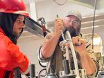 Vince Welton (right) and Colin Schmidt fix a CTD cable after it broke.
