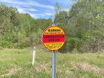 A sign for a carbon dioxide pipeline in Satartia, Miss. There are now about 5,300 miles of CO2 pipelines in the U.S., but in the next few decades, that number could grow to more than 65,000 miles.